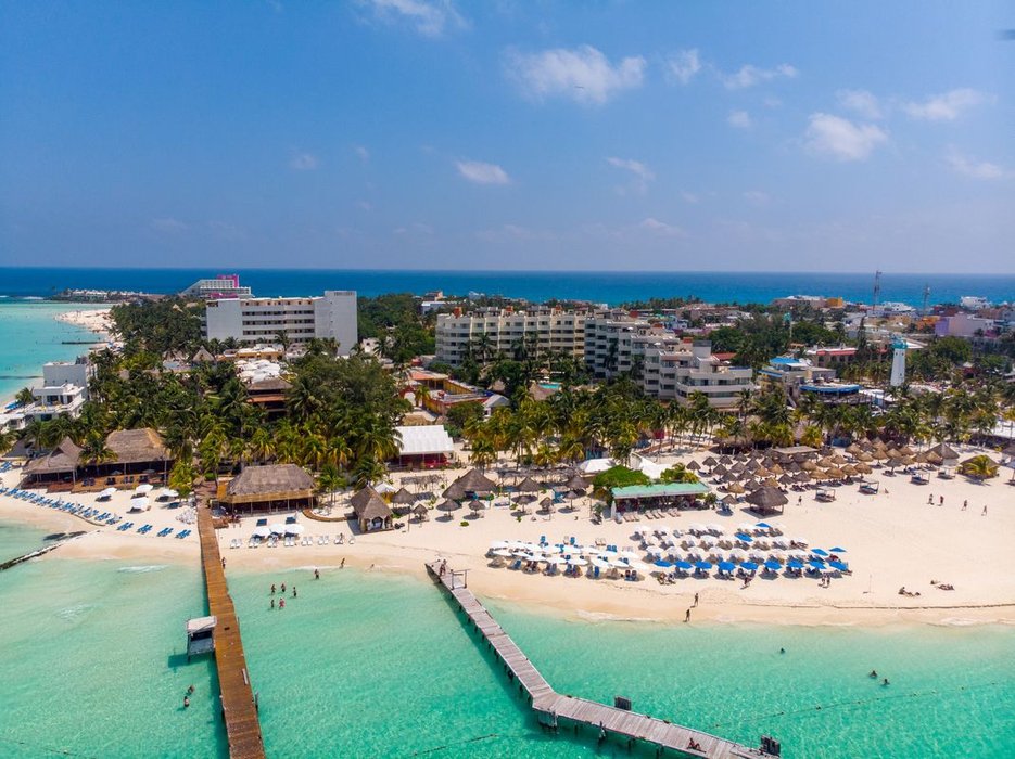 aerial view of the privilege aluxes resorts along with the hotels private beach area in Isla Mujeres, Mexico