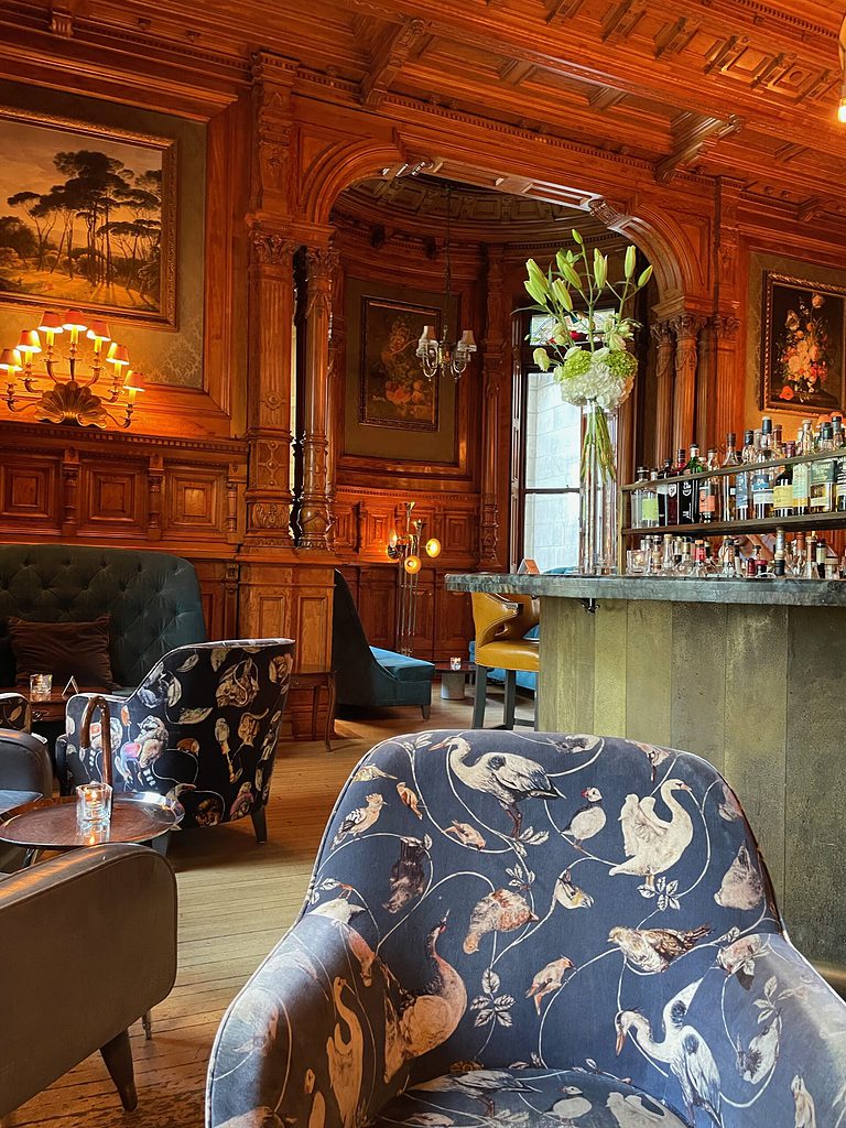 inside of a old style cigar bar renovated into a modern bar, the old style building inside bar george still holds