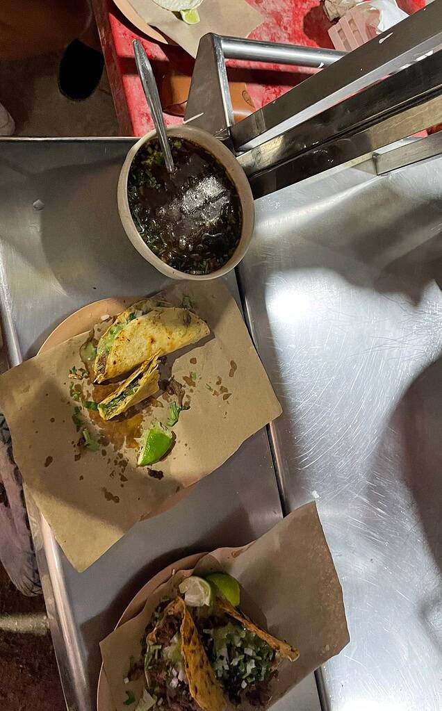 barbacoa tacos placed on a street stall beside barbacoa tacos in isla holbox mexico