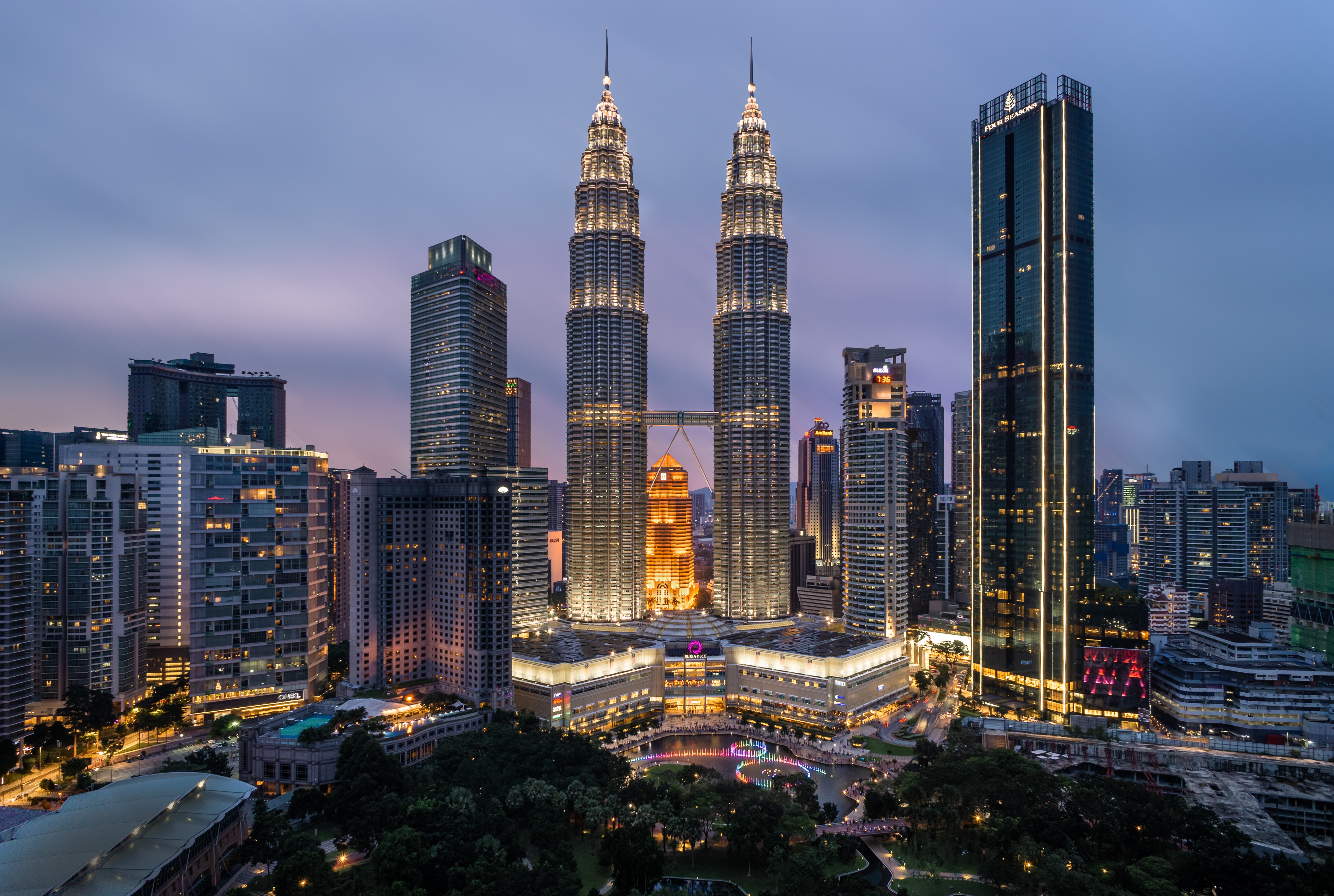 skyline at night of downtown Kuala Lumpur featuring the famous petronas towers in Malaysia
