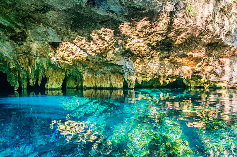 crystal clear torquiest water at gran cenote in tulum