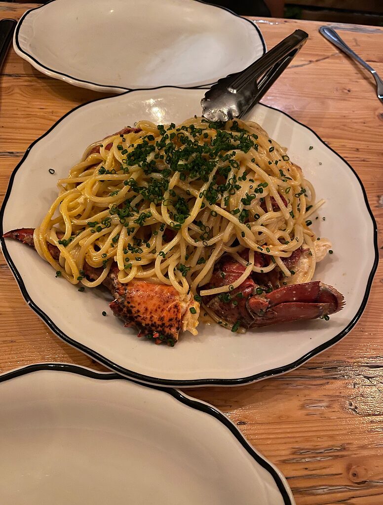 a plate full of lobster pasta at famous Joe Beef restaurants in Montreal, Canada