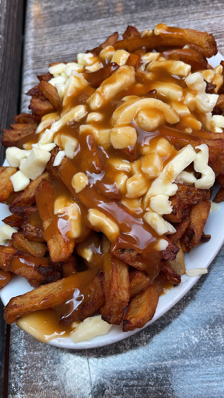 classic montreal food here a pountine from la banquise full of crispy fries with lots of cheese curds and gravy