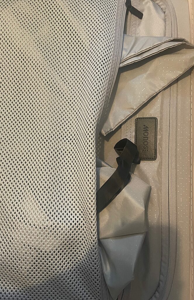 inside of the monos carry on, showing complimentary accessories with luggage 