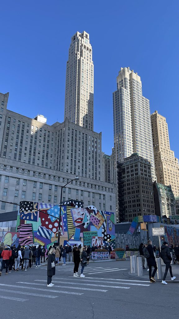 several buildings congested together in the busy Financial district of NYC