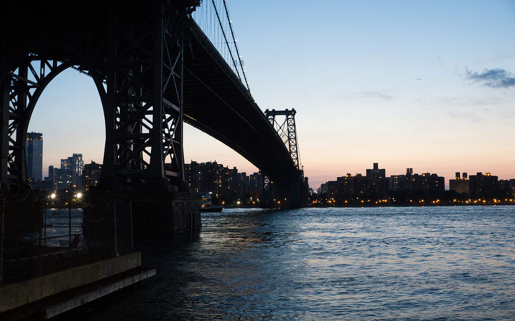 the Williamsburg Bridge during a beautiful sunset in New York City from the Brooklyn side 