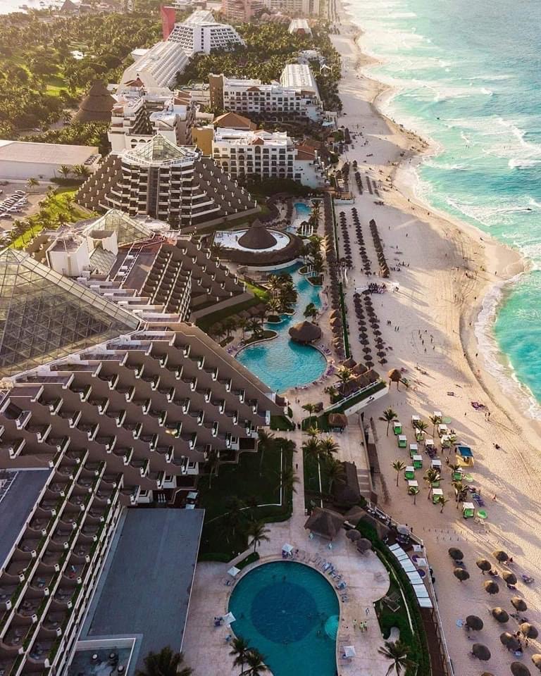 aerial views of a large resort along the Hotel Zone in Cancun with large beach shorelines