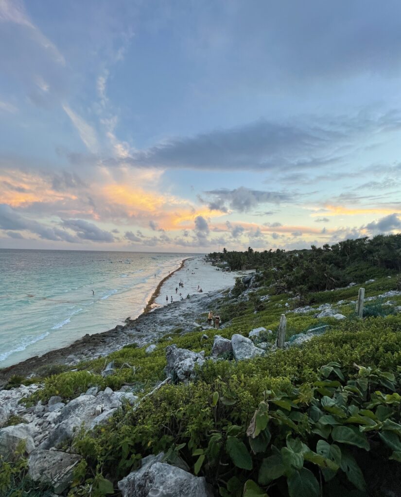 views at sunset of the entire Tulum Beach shoreline from a hill at Parque Nacional Tulum