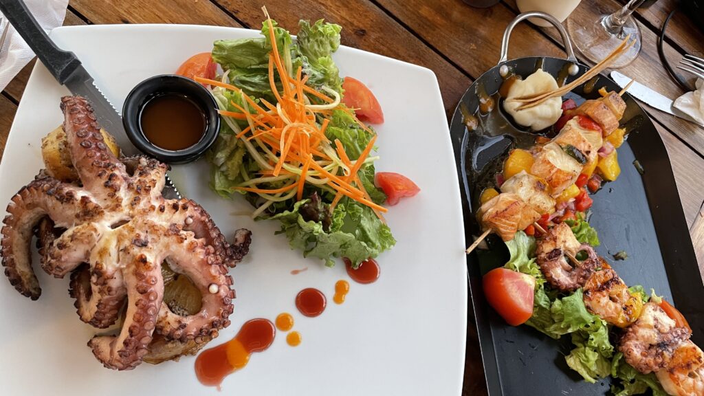 grilled octopus with salad and several seafood skewers at Chiltepin Marisquillos