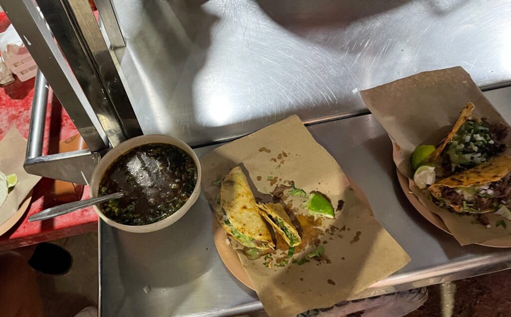 barbacoa tacos placed on a street stall beside barbacoa tacos in isla holbox mexico