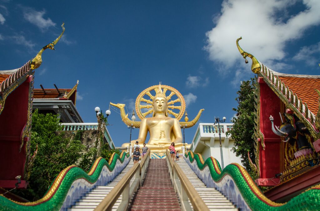 the famous golden Big Buddha in Koh Samui along with the many colourful steps to climb up to it 
