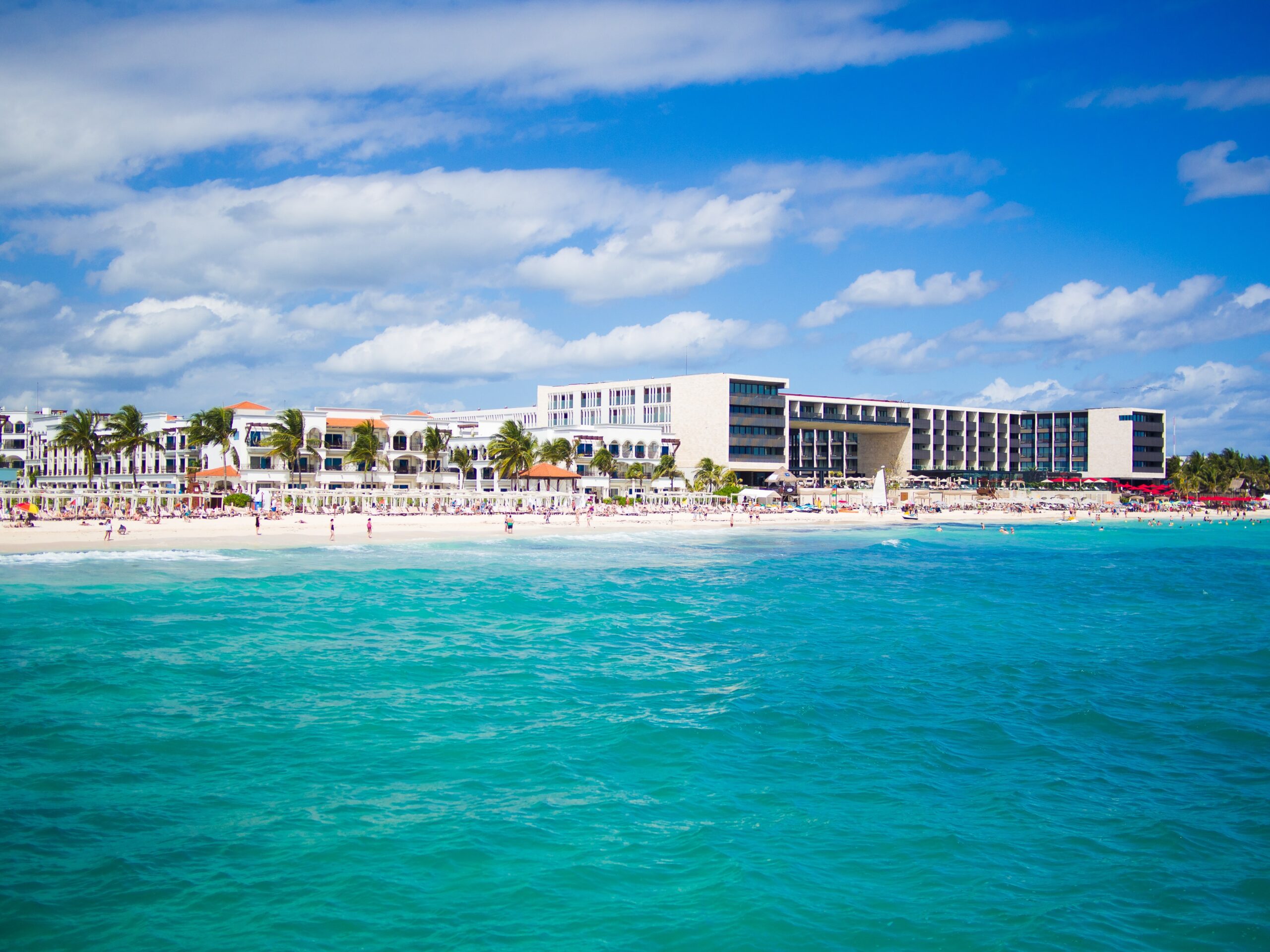 turquoise blue waters showing a Playa Del Carmen beach shoreline / Cancun to Playa Del Carmen