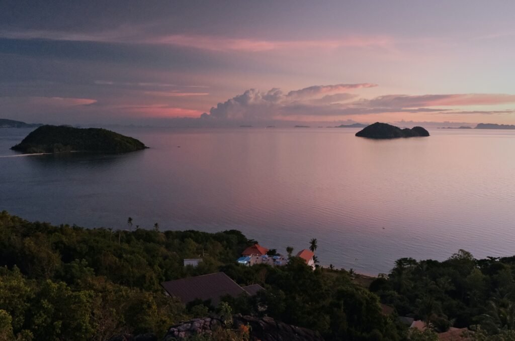 colourful sunset setting in from a mountain view top in Koh Phangan island in Thailand 