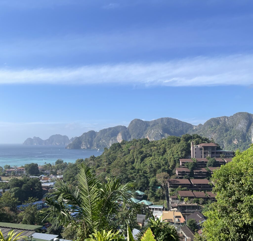 clear skies among many large limestones in the Andaman Sea from the Phi Phi Islands in Thailand 
