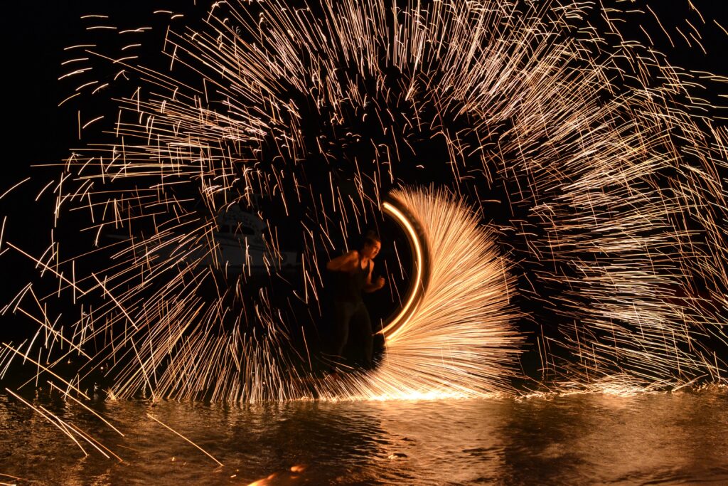 fire performer performing along the beach shorelines in Koh Samui, Thailand