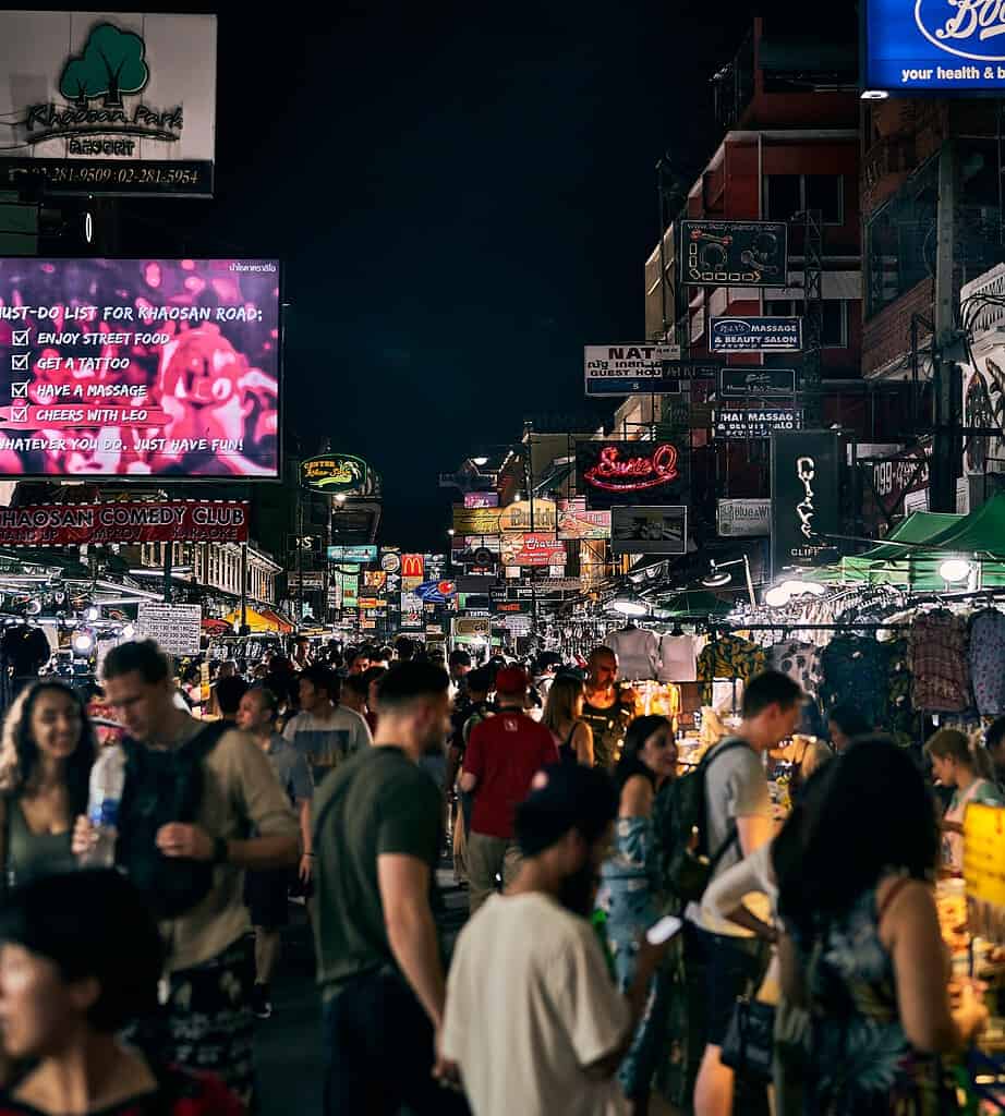 several tourist walking along the popular Khao San Road in Bangkok