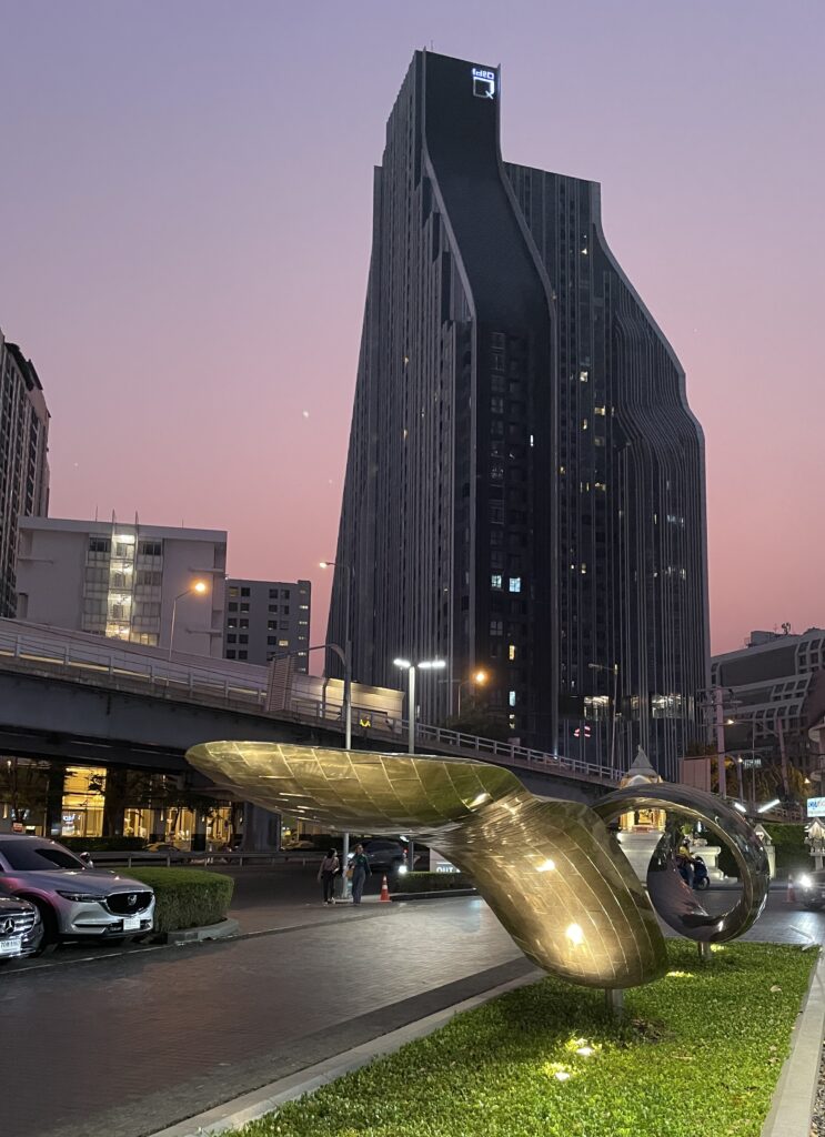 a vibrant sunset setting in amongst a skyscraper in Bangkok, Thailand 