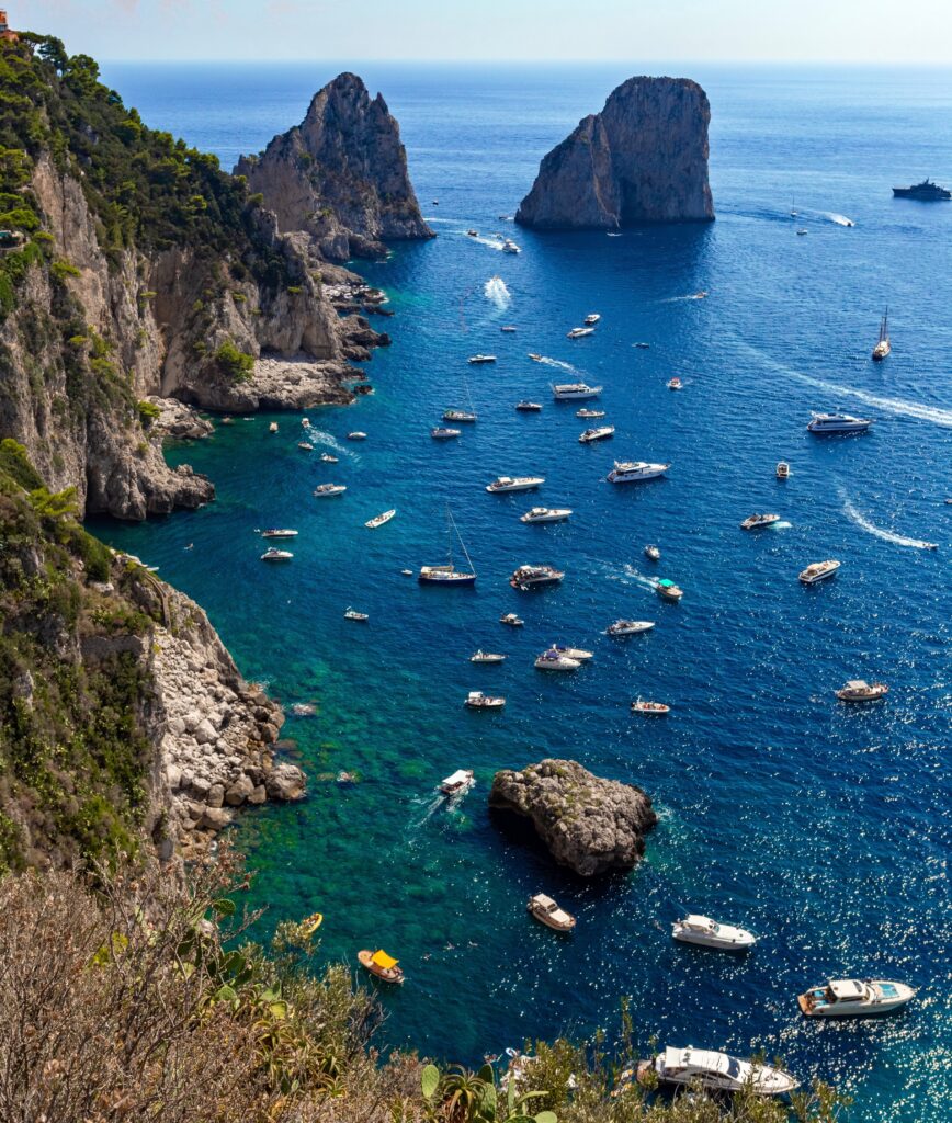 view from Giardini di Augusto overlooking the bay surrounding Scoglio Unghia Marina in Capri, Italy 