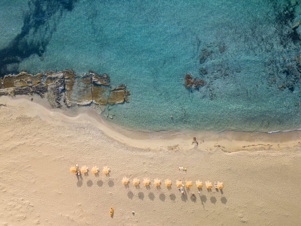 aerial shot of a stunning clear water beach in Crete, Greece