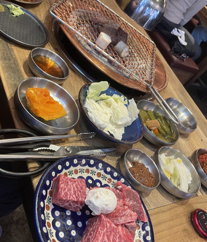 premium beef and several ban chan at a popular Korean BBQ spot, DOMA in Hongdae, Seoul