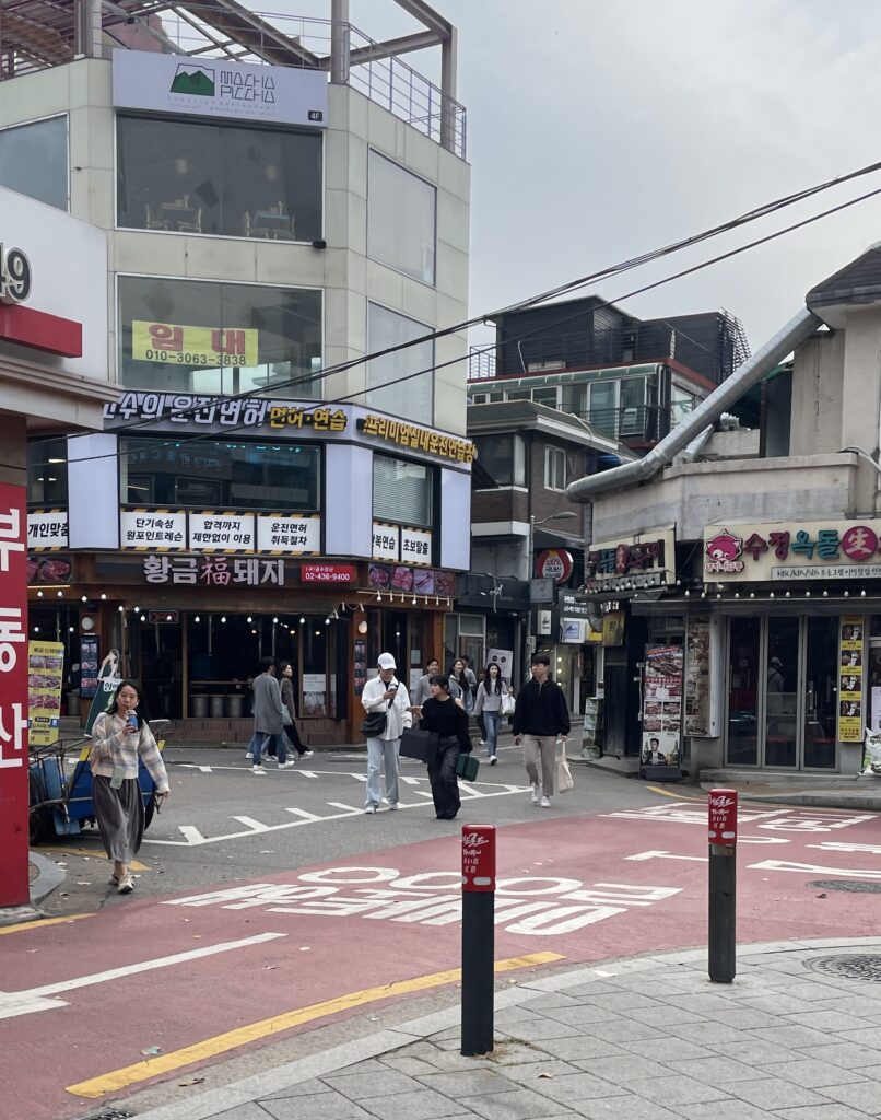 many locals walking around on a Saturday afternoon in Hongdae area, Seoul