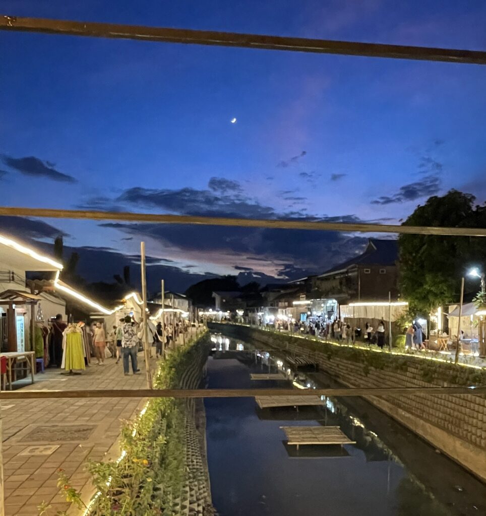 a vibrant sky at the Khlong Mae Kha Bridge in Chiang Mai