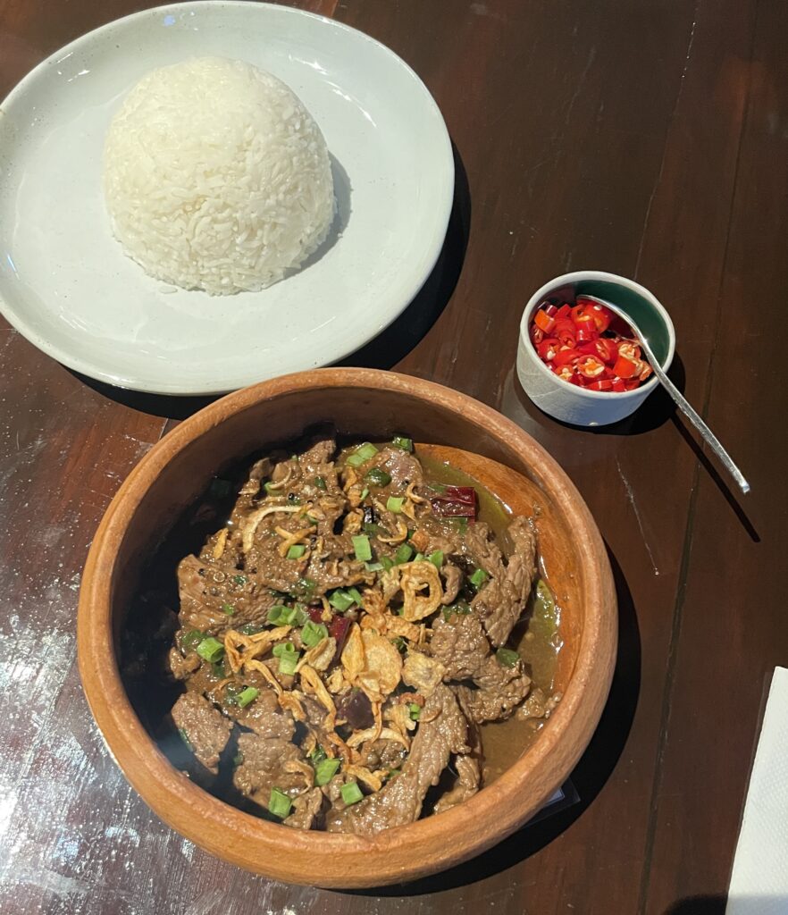 a beef based dish with rice and thai chili peppers at Kiti Panit in Chiang Mai