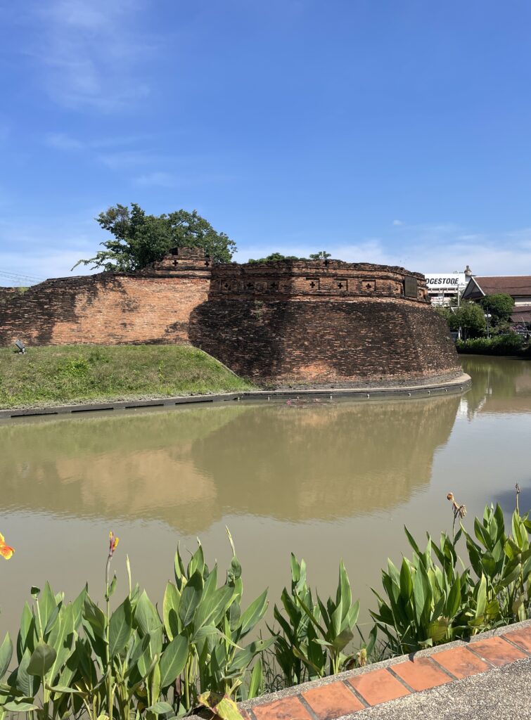 Ancient walls at the corner of Old City Chiang Mai, separated between a river