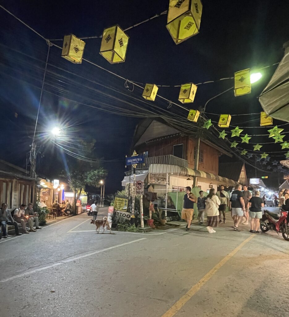 side streets with bars and many tourists walking amongst the Pai Night Market 