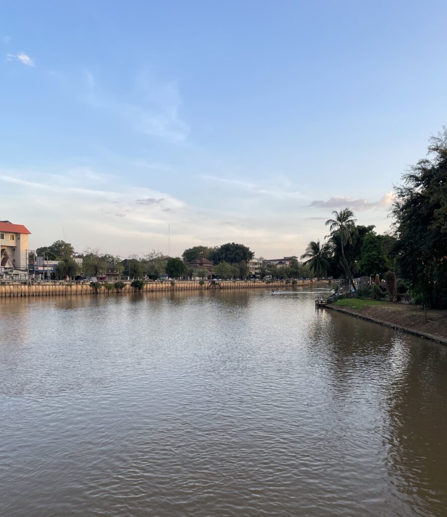views of the beautiful Ping River near sunset hours in Chiang Mai, Thailand 