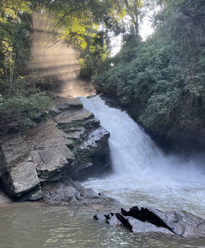 waterfalls with peaking sunlight in the forests of Chiang Mai, Thailand 