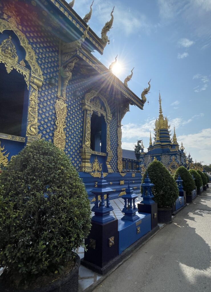 vibrant blue and gold trim temple known as the famous Blue Temple in Chiang Rai, Thailand 