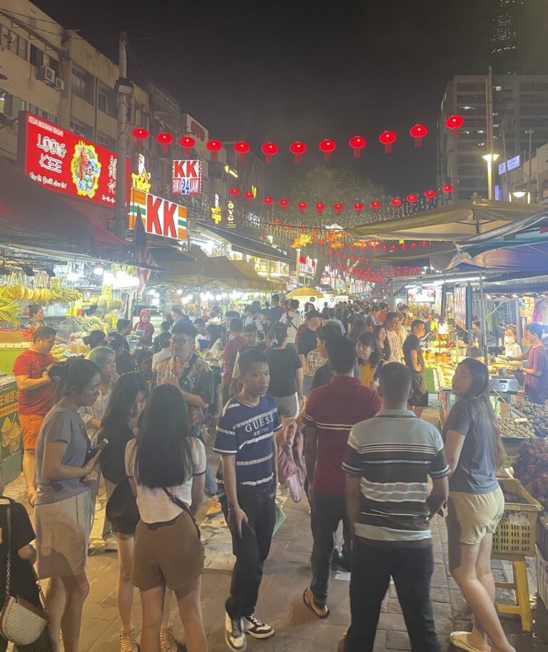 crowds walking by at the Jalan Night Market in Kuala Lumpur / Also known as the Jalan Alor Food Street