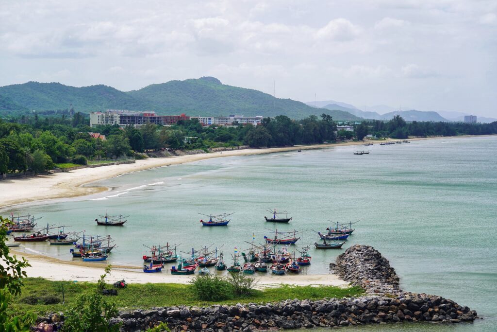 several boats docked along the beach in Hua Hin