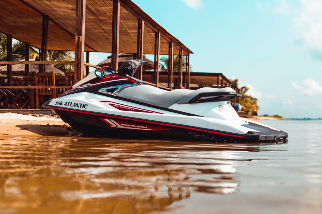 a jetski parked along a beach shoreline 