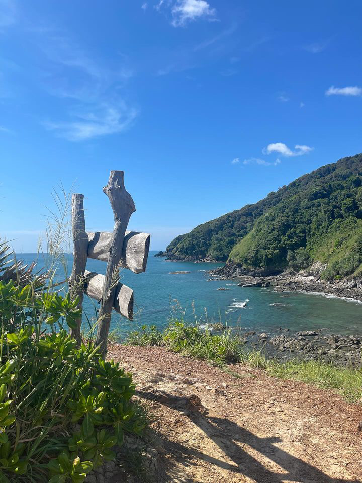 luscious green hills in the distance along the ocean in Koh Lanta, Thailand