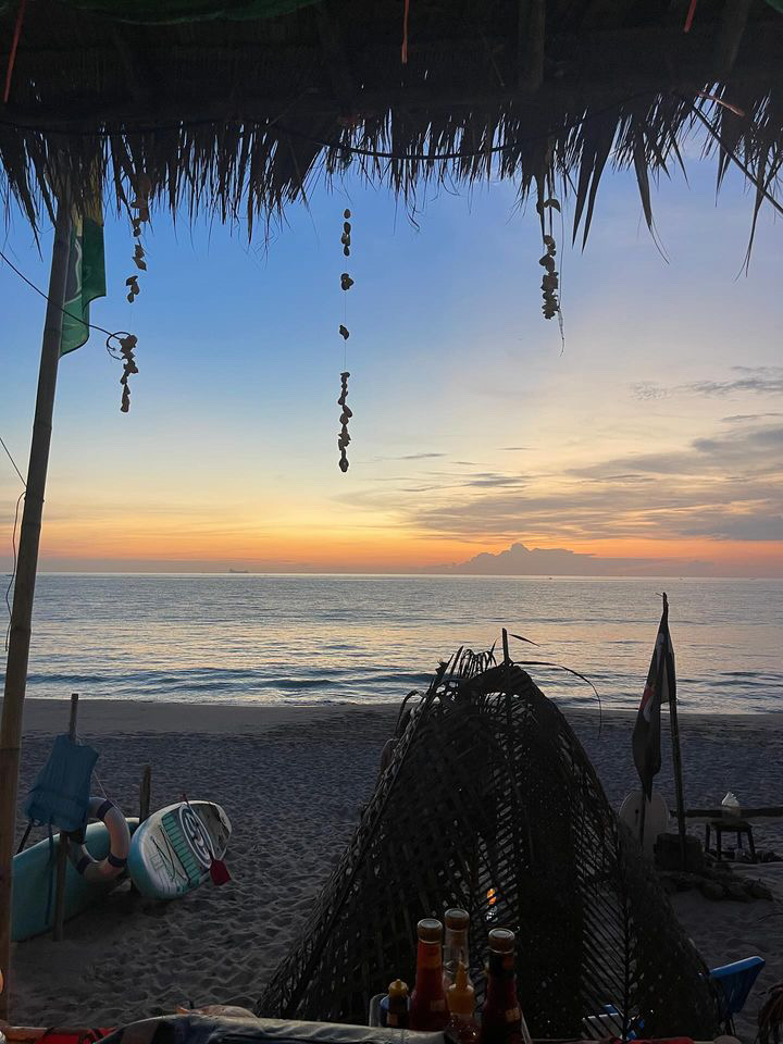 vibrant orange hued sunset at the beach in Koh Lanta
