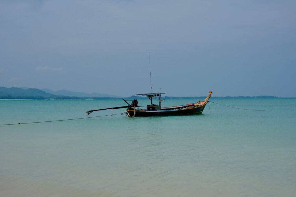 a Thai longtail in the turquoise waters in Khao Lak 