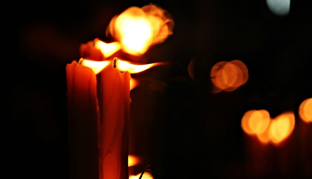 candles being lit during Mukha Bucha Day, a Buddhist traditional festival  