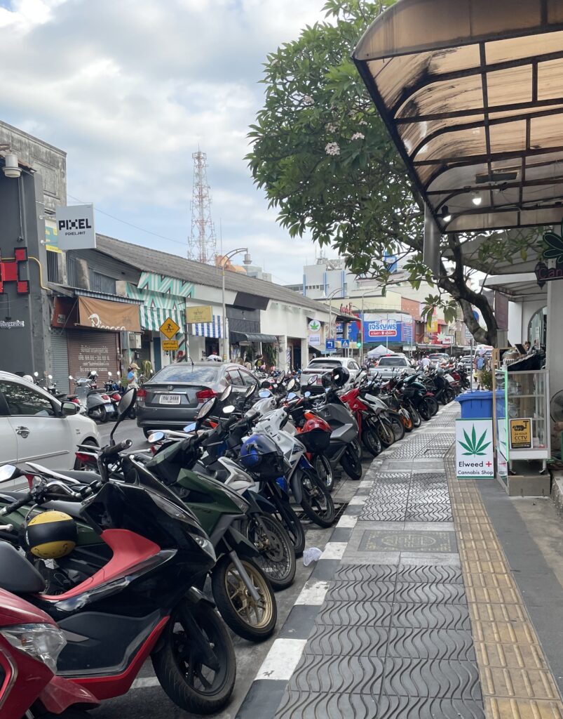several scooters parked next to one another in Old Phuket Town