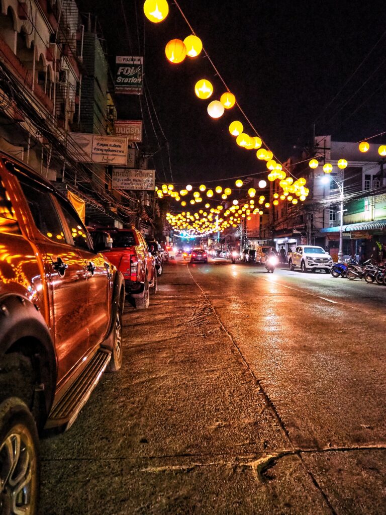 bright lights and cars passing by at night in Chiang Rai 