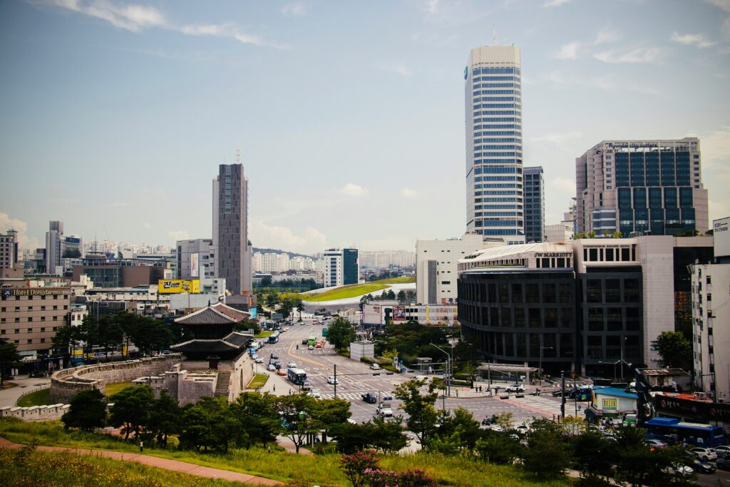 busy streets amongst skyscraper buildings in the Dongdaemun area of Seoul, Korea 