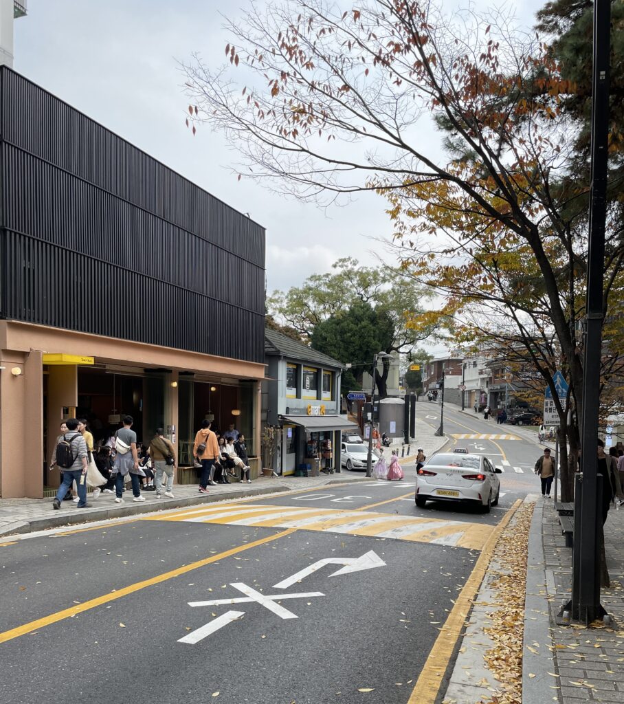 many locals walking in a picturesque street in Insadong, Seoul area during Fall