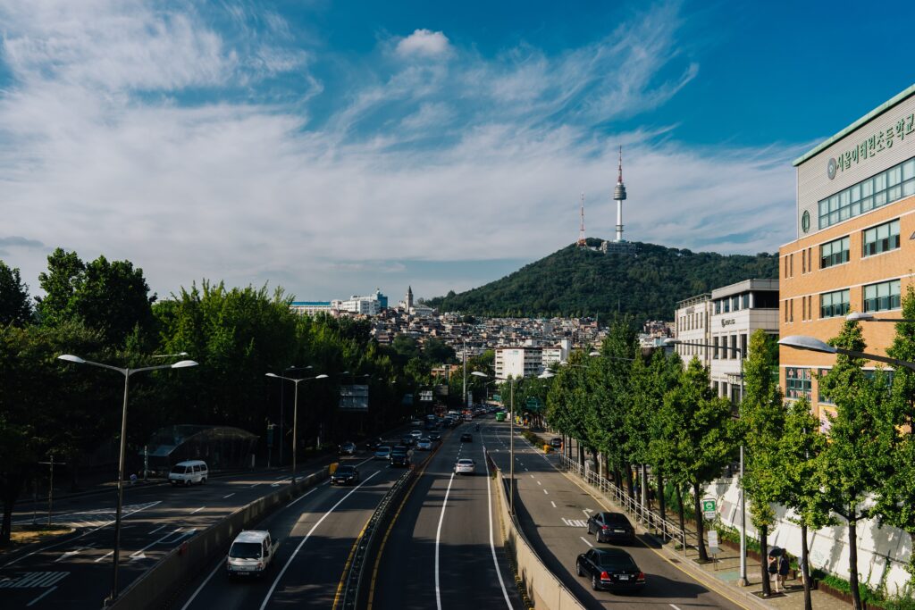 landscape views of highway roads with a mountain and N Seoul Tower in the distance in Seoul, Korea 