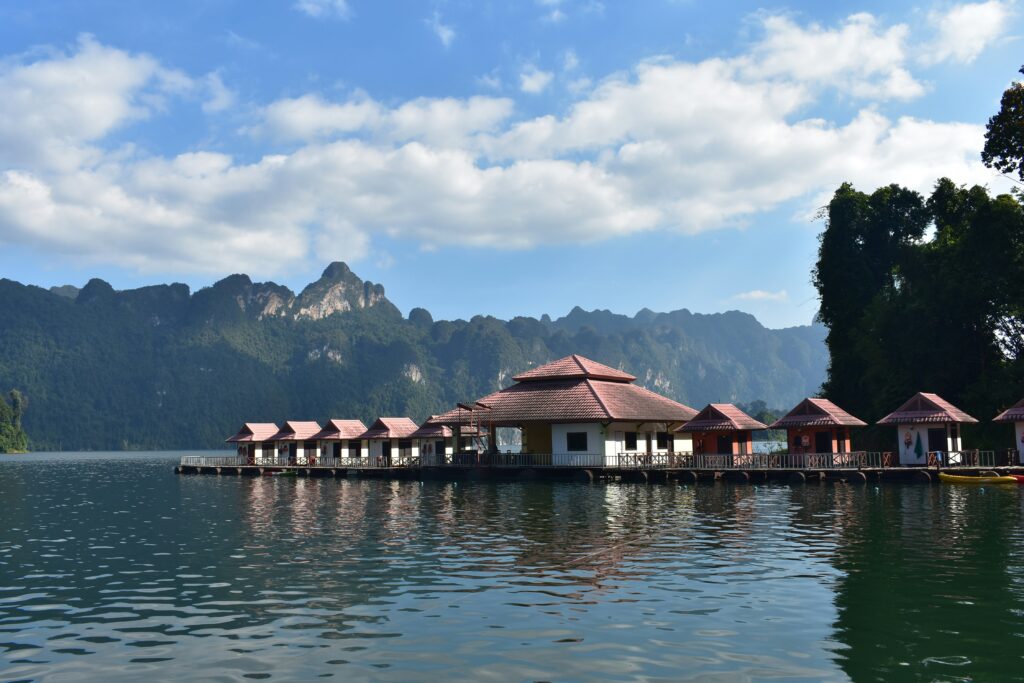 a floating resort on a lake water located around the stunning natural surroundings at Khao Sok National Park in Thailand