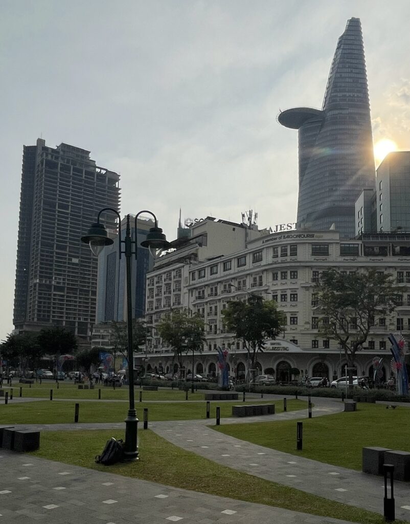beautiful park area amongst many buildings at sunset at Bach dang Park in Saigon