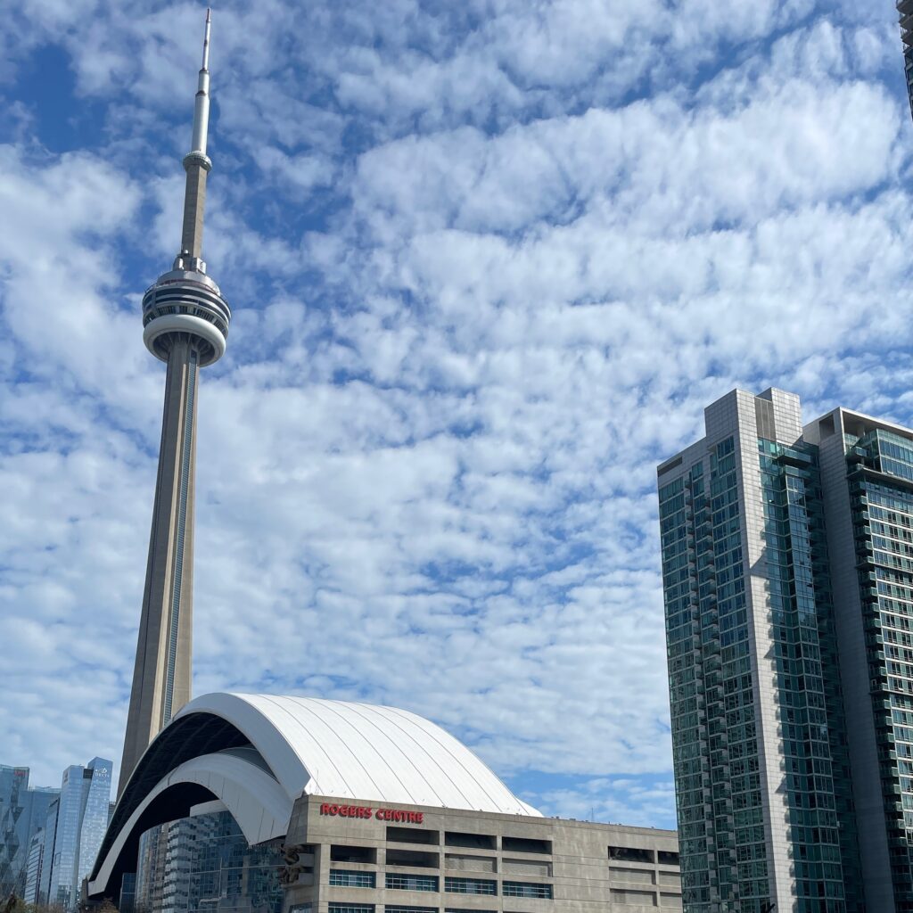 the CN Tower and Rogers centre in Toronto, Canada on a sunny day