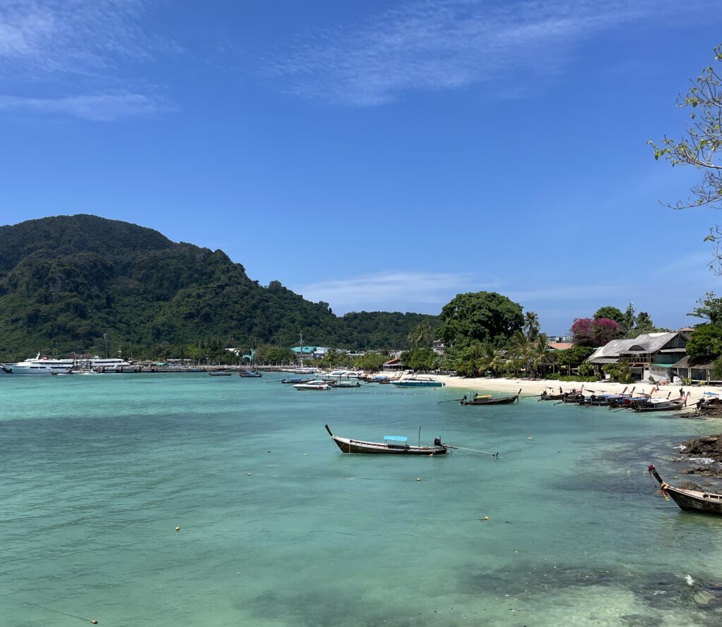 stunning shades of turquoise water in Phi Phi Don along with many lush green forests and beaches in the background / Krabi Itinerary 4 days