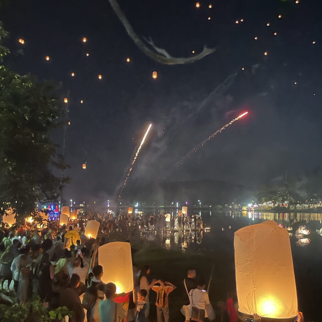 many locals and tourist releasing lanterns at Doi Sak National Park in Northern Thailand 