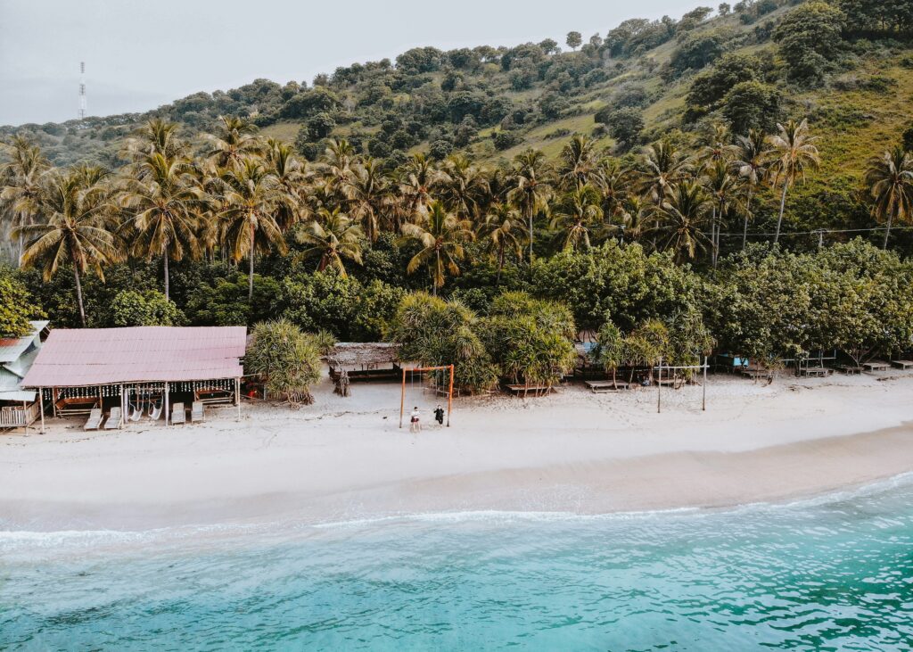 locals along a beautiful beach during the evening in Lombok, Indonesia 